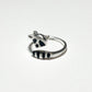 An adjustable silver ring of a raccoon